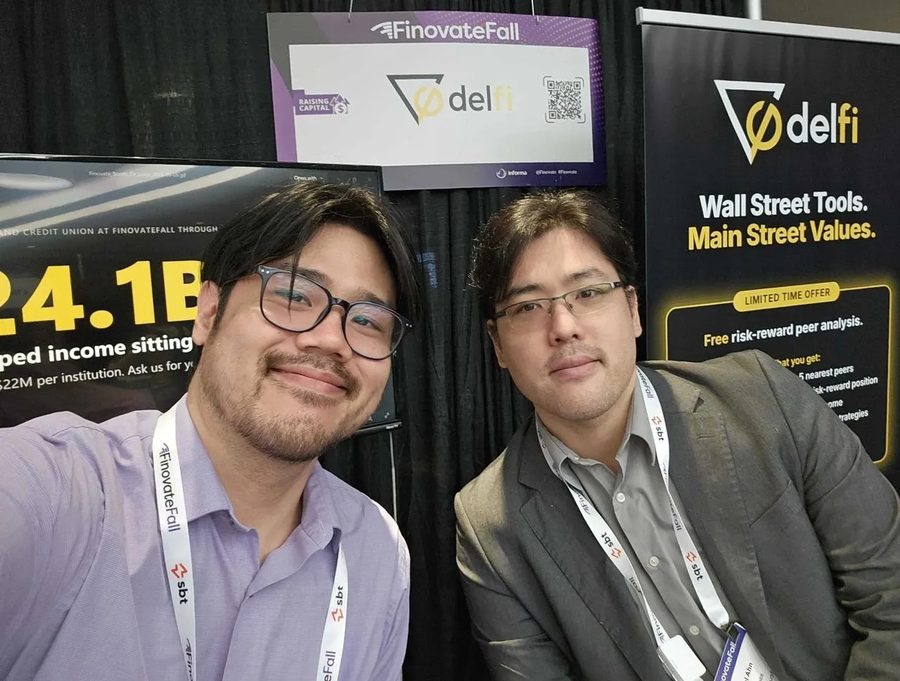 The Delfi team at the Delfi booth at FinovateFall 2026, in front of the “Wall Street Tools. Main Street Values.” banner.