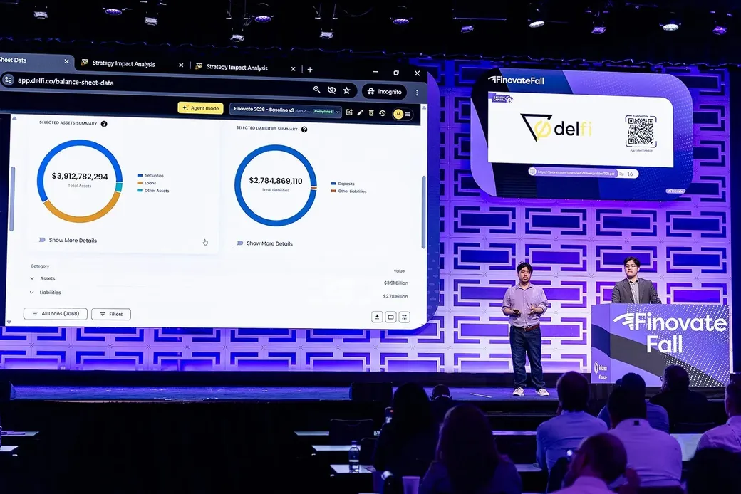 Delfi on the FinovateFall 2026 main stage, with the Overwatch balance sheet view showing total assets and total liabilities on the display behind the presenters.
